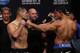 Oct 18, 2013; Houston, TX, USA; Cain Velasquez, left, and Junior Dos Santos, right, during the weigh-in for UFC 166 at Toyota Center. Mandatory Credit: Andrew Richardson-USA TODAY Sports