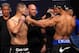 Oct 19, 2013; Houston, TX, USA; K.J. Noons (blue gloves) fights against George Sotiropoulos (red gloves) in their lightweight bout during UFC 166 at Toyota Center. Mandatory Credit: Andrew Richardson-USA TODAY Sports