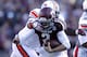 HOUSTON, TX - OCTOBER 19: Johnny Manziel #2 of the Texas A&M Aggies is tackled by Gabe Wright #90 of the Auburn Tigers on October 19, 2013 at Kyle Field in College Station, Texas. Auburn Tigers won 45 to 41.(Photo by Thomas B. Shea/Getty Images)