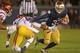 SOUTH BEND, IN - OCTOBER 19: Cam McDaniel #33 of the Notre Dame Fighting Irish breaks a tackle by Su'a Cravens #21 of the University of Southern California Trojans at Notre Dame Stadium on October 19, 2013 in South Bend, Indiana. (Photo by Jonathan Daniel/Getty Images)