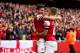 LONDON, ENGLAND - OCTOBER 19: Jack Wilshere of Arsenal celebrates with Olivier Giroud (L) as he scores their first goal during the Barclays Premier League match between Arsenal and Norwich City at Emirates Stadium on October 19, 2013 in London, England. (Photo by Paul Gilham/Getty Images)