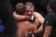 Oct 19, 2013; Houston, TX, USA; Cain Velasquez (red gloves) embraces Junior Dos Santos (blue gloves) following the world heavyweight championship bout during UFC 166 at Toyota Center. Mandatory Credit: Andrew Richardson-USA TODAY Sports