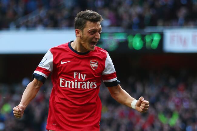 Hi-res-185350280-mesut-oezil-of-arsenal-celebrates-as-he-scores-their_crop_north