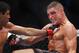 Oct 19, 2013; Houston, TX, USA; Gilbert Melendez (red gloves) fights against Diego Sanchez (blue gloves) in their lightweight bout during UFC 166 at Toyota Center. Mandatory Credit: Andrew Richardson-USA TODAY Sports