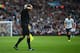 BIRMINGHAM, ENGLAND - OCTOBER 20: Referee's assistant David Bryan clutches his shirt after he was hit by a missile from the crowd during the Barclays Premier League match between Aston Villa and Tottenham Hotspur at Villa Park on October 20, 2013 in Birmingham, England. (Photo by Michael Regan/Getty Images)