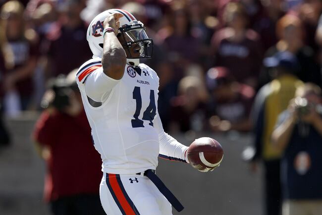 Hi-res-185361381-nick-marshall-of-the-auburn-tigers-celebrates-his_crop_north