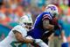 MIAMI GARDENS, FL - OCTOBER 20: T.J. Graham #11 of the Buffalo Bills is tackled by Dimitri Patterson #24 of the Miami Dolphins at Sun Life Stadium on October 20, 2013 in Miami Gardens, Florida. (Photo by Chris Trotman/Getty Images)