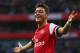LONDON, ENGLAND - OCTOBER 19: Mesut Oezil of Arsenal celebrates as he scores their second goal during the Barclays Premier League match between Arsenal and Norwich City at the Emirates Stadium on October 19, 2013 in London, England. (Photo by Paul Gilham/Getty Images)