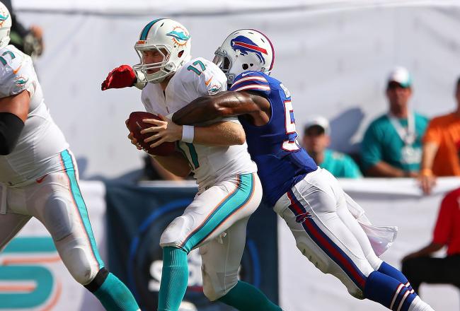 Hi-res-185429859-ryan-tannehill-of-the-miami-dolphins-is-sacked-by-kiko_crop_north