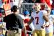 Oct 20, 2013; Nashville, TN, USA; San Francisco 49ers quarterback Colin Kaepernick (7) is congratulated by head coach Jim Harbaugh after scoring a touchdown against the Tennessee Titans during the first half at LP Field. Mandatory Credit: Jim Brown-USA TODAY Sports
