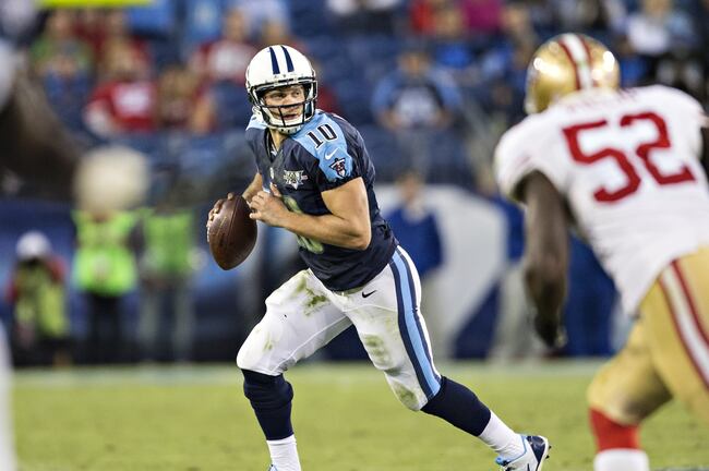 Hi-res-185446357-jake-locker-of-the-tennessee-titans-rolls-out-looking_crop_north