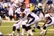 Oct 20, 2013; Indianapolis, IN, USA; Denver Broncos quarterback Peyton Manning (18) drops back to hand off during the game against the Indianapolis Colts at Lucas Oil Stadium. Mandatory Credit: Brian Spurlock-USA TODAY Sports