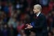 LONDON, ENGLAND - OCTOBER 01: Arsene Wenger the Arsenal manager directs his players on during UEFA Champions League Group F match between Arsenal FC and SSC Napoli at Emirates Stadium on October 1, 2013 in London, England. (Photo by Paul Gilham/Getty Images)