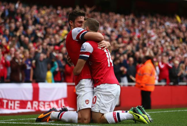 Hi-res-185435786-jack-wilshere-of-arsenal-celebrates-with-olivier-giroud_crop_north