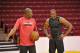 Former Rockets great Hakeem Olajuwon works with new Rockets big man Dwight Howard on his post game.