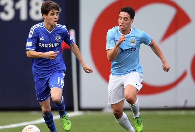 Hi-res-169488661-oscar-of-chelsea-takes-the-ball-as-samir-nasri-of_crop_north