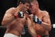 Oct 19, 2013; Houston, TX, USA; Gilbert Melendez (red gloves) fights against Diego Sanchez (blue gloves) in their lightweight bout during UFC 166 at Toyota Center. Mandatory Credit: Andrew Richardson-USA TODAY Sports