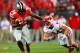 Sep 28, 2013; Columbus, OH, USA; Ohio State Buckeyes running back Carlos Hyde (34) stiff arms Wisconsin Badgers linebacker Chris Borland (44) during the first quarter at Ohio Stadium. Mandatory Credit: Andrew Weber-USA TODAY Sports