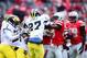 Nov 24, 2012; Columbus, OH, USA; Michigan Wolverines linebacker Mike Jones (27) fights with Ohio State Buckeyes cornerback Adam Griffin (9) in the fourth quarter at Ohio Stadium. Mandatory Credit: Andrew Weber-USA TODAY Sports
