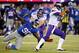 Oct 21, 2013; East Rutherford, NJ, USA; Minnesota Vikings quarterback Josh Freeman (12) eludes New York Giants defensive end Jason Pierre-Paul (90) during the second half at MetLife Stadium. The Giants won the game 23-7. Mandatory Credit: Joe Camporeale-USA TODAY Sports