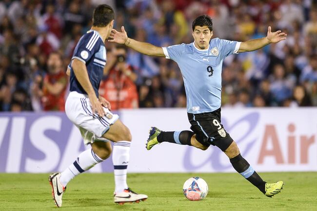 Hi-res-184746049-luis-suarez-of-uruguay-vies-for-the-ball-with-sebastian_crop_north