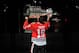CHICAGO, IL - OCTOBER 01: Jonathan Toews #19 of the Chicago Blackhawks kisses the Stanley Cup during the opening ceremony before the home opener against the Washington Capitals on October 1, 2013 at the United Center in Chicago, Illinois. (Photo by Bill Smith/NHLI via Getty Images)