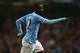 MANCHESTER, ENGLAND - SEPTEMBER 24: Yaya Toure of Manchester City celebrates after scoring the third goal from a free kick during the Capital One Cup third round match between Manchester City and Wigan Athletic at Etihad Stadium on September 24, 2013 in Manchester, England. (Photo by Alex Livesey/Getty Images)