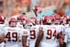 Oct 12, 2013; Dallas, TX, USA; Oklahoma Sooners huddle and raise a helmet prior to the game against the Texas Longhorns during the Red River Rivalry at the Cotton Bowl Stadium. Mandatory Credit: Matthew Emmons-USA TODAY Sports