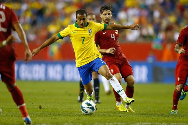 Hi-res-180268989-lucas-moura-of-brazil-carries-the-ball-past-miguel_crop_north