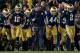 Oct 19, 2013; South Bend, IN, USA; Notre Dame Fighting Irish head coach Brian Kelly runs onto the field with his team prior the game against the USC Trojans at Notre Dame Stadium. Notre Dame won 14-10. Mandatory Credit: Matt Cashore-USA TODAY Sports