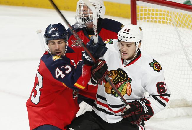 Hi-res-185607885-andrew-shaw-of-the-chicago-blackhawks-and-mike-weaver_crop_north