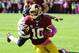 Oct 20, 2013; Landover, MD, USA; Washington Redskins quarterback Robert Griffin III (10) runs with the ball against the Chicago Bears during the first half at FedEX Field. Mandatory Credit: Brad Mills-USA TODAY Sports