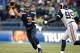 SEATTLE, WA - DECEMBER 30: Russell Wilson #3 of the Seattle Seahawks is throws under pressure from the St. Louis Rams in the first half at CenturyLink Field on December 30, 2012 in Seattle, Washington. (Photo by Kevin Casey/Getty Images)