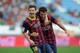 ALMERIA, SPAIN - SEPTEMBER 28: Lionel Messi (L) of FC Barcelona celebrates with team-mate Cesc Fabregas after scoring the opening goal during the La Liga match between UD Almeria and FC Barcelona on September 28, 2013 in Almeria, Spain. (Photo by Denis Doyle/Getty Images)