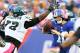 EAST RUTHERFORD, NJ - OCTOBER 06: Eli Manning #10 of the New York Giants is pressured by Trent Cole 58 and Cedric Thornton #72 of the Philadelphia Eagles at MetLife Stadium on October 6, 2013 in East Rutherford, New Jersey.The Philadelphia Eagles defeated the New York Giants 36-21. (Photo by Elsa/Getty Images)