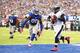 EAST RUTHERFORD, NJ - OCTOBER 06: Michael Vick #7 of the Philadelphia Eagles scrambles against Jason Pierre-Paul #90 of the New York Giants in the second quarter during their game at MetLife Stadium on October 6, 2013 in East Rutherford, New Jersey. (Photo by Al Bello/Getty Images)
