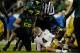 EUGENE, OR - DECEMBER 02: Quarterback Kevin Prince #4 of the UCLA Bruins sit on the ground after being sacked by the Oregon Ducks during the Pac 12 Championship Game on December 2, 2011 at the Autzen Stadium in Eugene, Oregon. (Photo by Jonathan Ferrey/Getty Images)