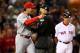 BOSTON, MA - OCTOBER 23: Manager Mike Matheny #22 of the St. Louis Cardinals argues a call with home plate umpire John Hirschbeck #17 in the first inning during Game One of the 2013 World Series against the Boston Red Sox at Fenway Park on October 23, 2013 in Boston, Massachusetts. (Photo by Elsa/Getty Images)