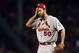 Oct 23, 2013; Boston, MA, USA; St. Louis Cardinals starting pitcher Adam Wainwright (50) reacts during the second inning during game one of the MLB baseball World Series against the Boston Red Sox at Fenway Park. Mandatory Credit: Greg M. Cooper-USA TODAY Sports