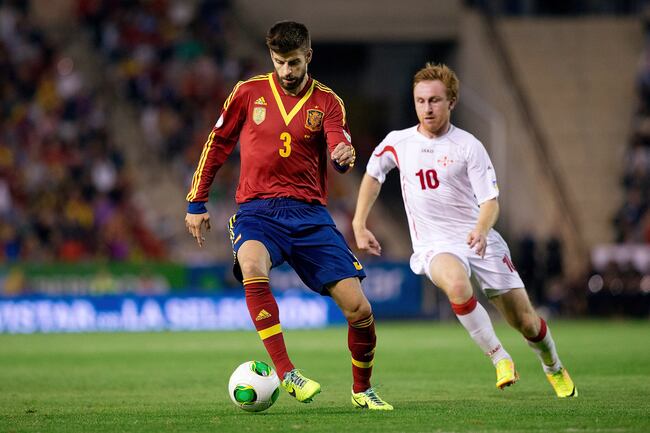 Hi-res-185480853-gerard-pique-of-spain-competes-for-the-ball-with-jano_crop_north