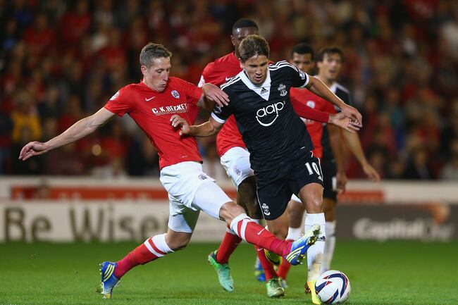 Hi-res-178222816-gaston-ramirez-of-southampton-is-tackled-by-jimmy_crop_north