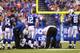 INDIANAPOLIS, IN - OCTOBER 20: Reggie Wayne #87 of the Indianapolis Colts is tended to by medical personal after injuring his knee against the Denver Broncos at Lucas Oil Stadium on October 20, 2013 in Indianapolis, Indiana. The Colts beat the Broncos 39-33. (Photo by Dilip Vishwanat/Getty Images)