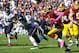 Oct 20, 2013; Landover, MD, USA; Washington Redskins quarterback Robert Griffin III (10) runs with the ball as Chicago Bears defensive end Julius Peppers (90) chases during the second half at FedEX Field. Mandatory Credit: Brad Mills-USA TODAY Sports