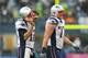SEATTLE, WA - OCTOBER 14: Quarterback Tom Brady #12 (L) of the New England Patriots walks off the field along with tackle Nate Solder #77 after being intercepted by cornerback Richard Sherman of the Seattle Seahawks at CenturyLink Field on October 14, 2012 in Seattle, Washington. The Seahawks defeated the Patriots 24-23. (Photo by Otto Greule Jr/Getty Images)