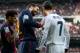 MADRID, SPAIN - MARCH 02: Gerard Pique (L) of Barcelona reacts to Cristiano Ronaldo (R) of Real Madrid after referee Miguel Perez fined Pique with a yellow card for fouling Ronaldo during the la Liga match between Real Madrid CF and FC Barcelona at Estadio Santiago Bernabeu on March 2, 2013 in Madrid, Spain. (Photo by Jasper Juinen/Getty Images)