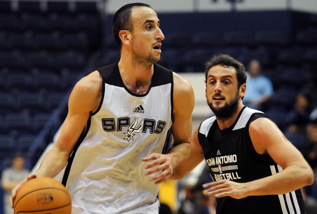 Hi-res-182996247-manu-ginobili-drives-to-the-basket-against-marco_crop_north