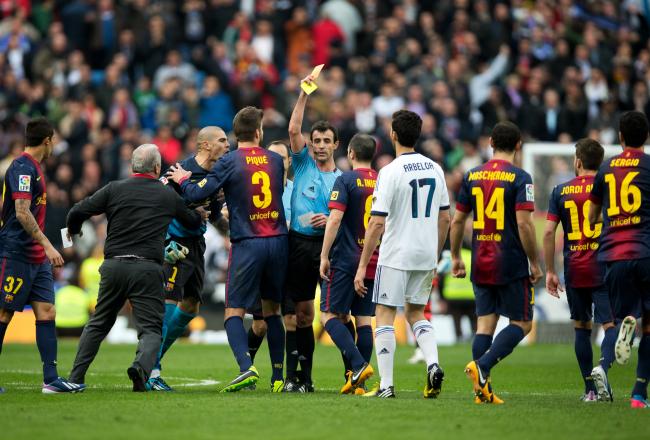 Hi-res-162960949-referee-miguel-perez-pulls-a-red-card-for-goalkeeper_crop_north