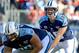 Oct 20, 2013; Nashville, TN, USA; Tennessee Titans quarterback Jake Locker (10) takes the snap from center Brian Schwenke (62) during the game against the San Francisco 49ers at LP Field. The 49ers beat the Titans 31-17. Mandatory Credit: Don McPeak-USA TODAY Sports