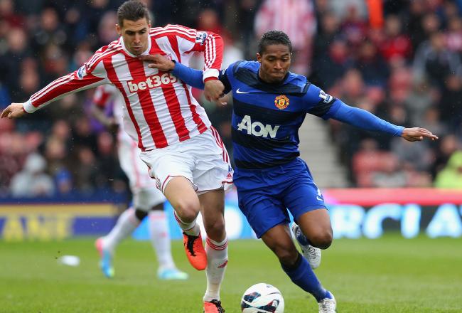 Hi-res-166588197-antonio-valencia-of-manchester-united-holds-off-the_crop_north