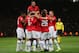 MANCHESTER, ENGLAND - OCTOBER 23: Wayne Rooney of Manchester United celebrates with his team-mates after Inigo Martinez of Real Sociedad scored an own goal to make the score 1-0 during the UEFA Champions League Group A match between Manchester United and Real Sociedad at Old Trafford on October 23, 2013 in Manchester, England. (Photo by Alex Livesey/Getty Images)